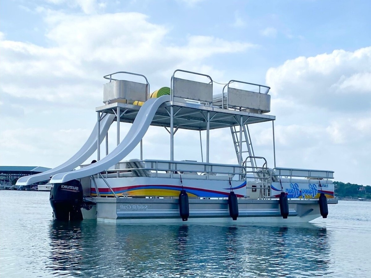 a boat is docked next to a body of water
