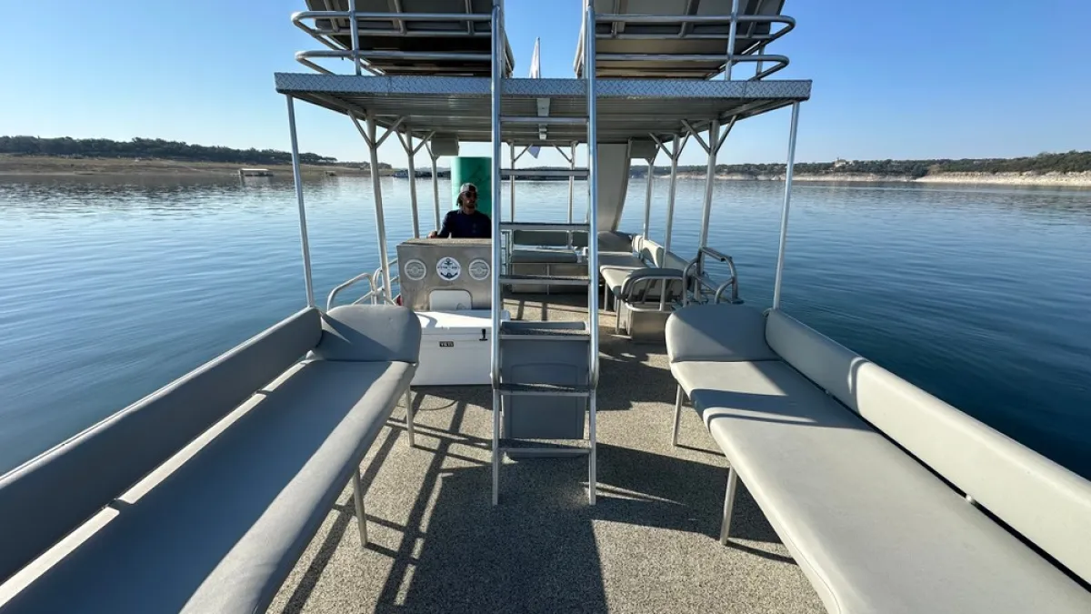 a boat is docked next to a body of water
