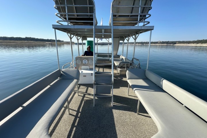 a boat is docked next to a body of water