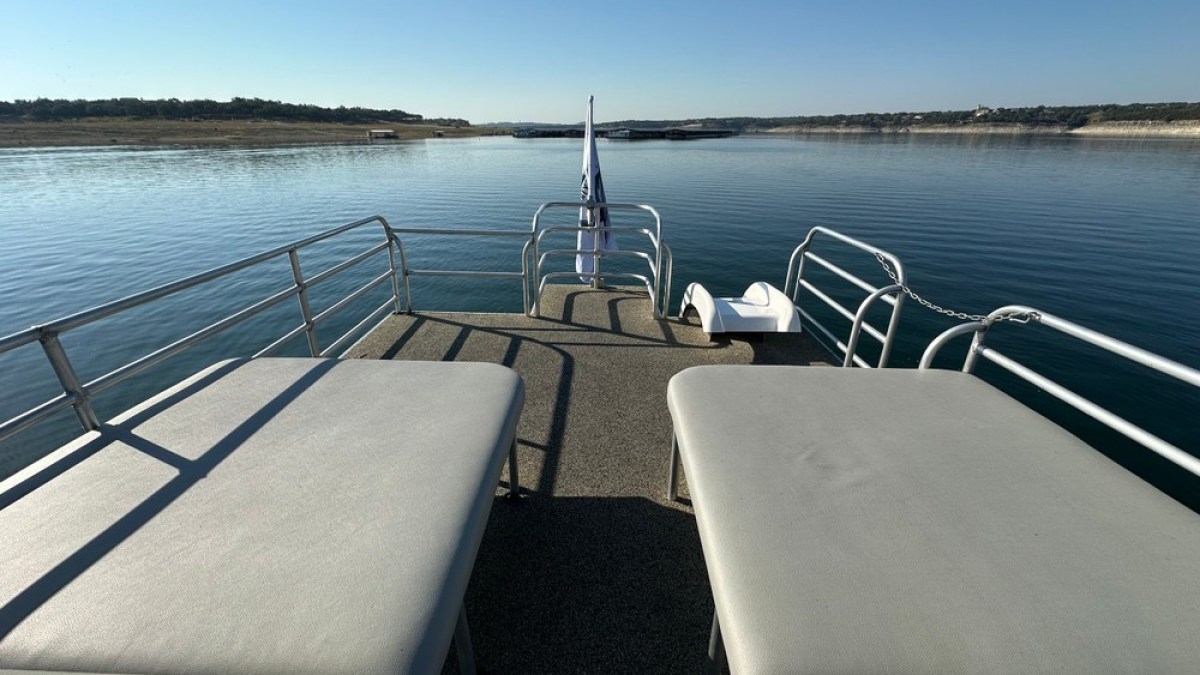 a boat is docked next to a body of water