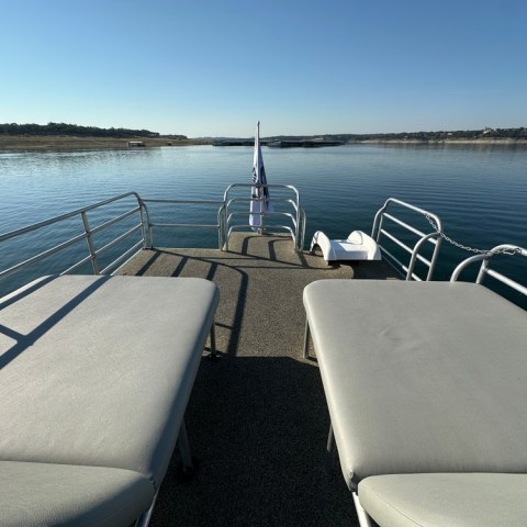 a boat is docked next to a body of water