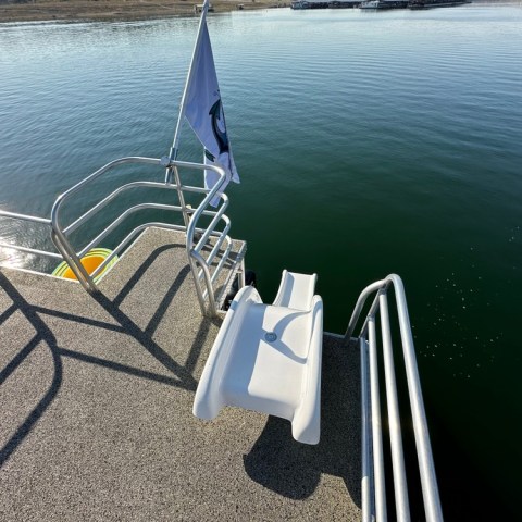 a chair sitting in front of a body of water