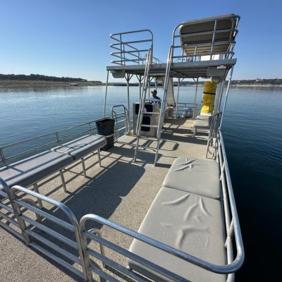 a boat that is sitting on a bench next to a body of water