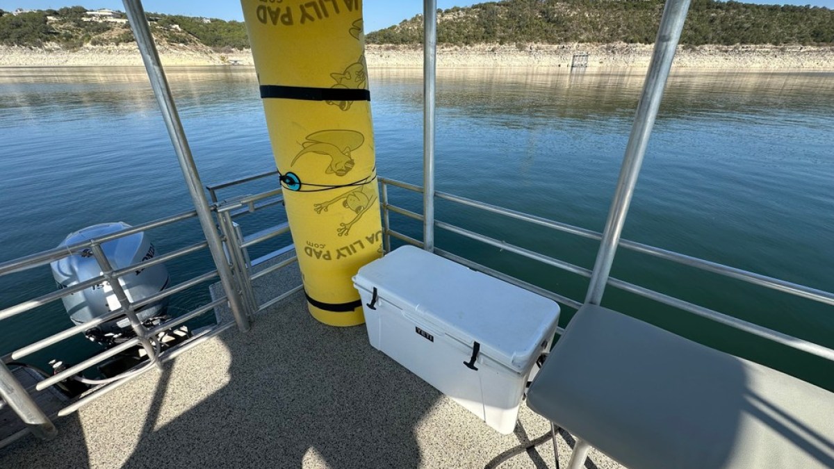 a boat that is sitting in front of a body of water