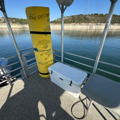 a boat that is sitting in front of a body of water