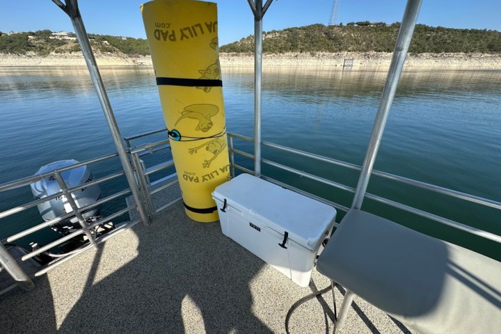 a boat that is sitting in front of a body of water