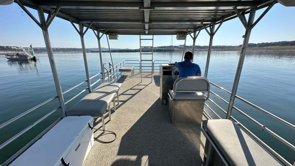 a boat is docked next to a body of water