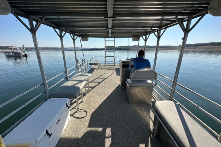 a boat is docked next to a body of water