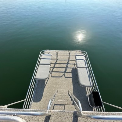 a boat that is sitting on a dock next to a body of water