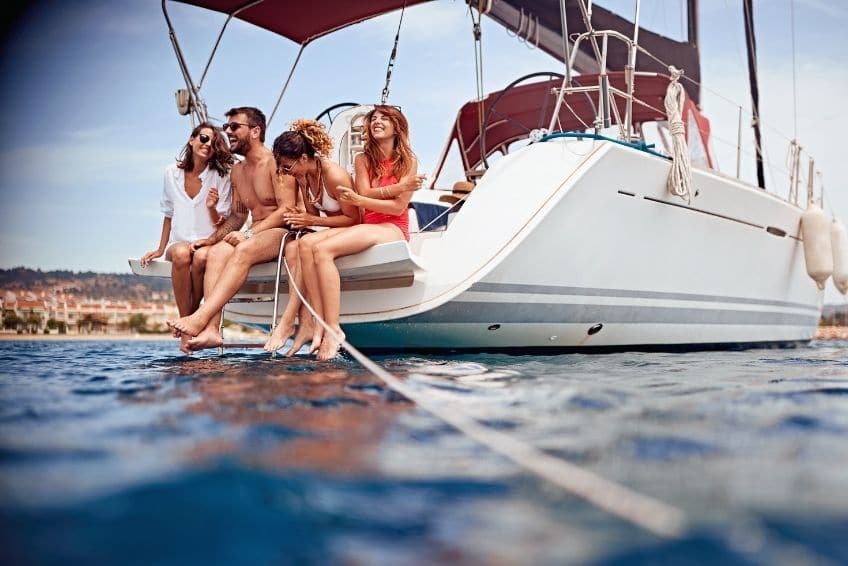 ATXPartyBoats-118448-Family-Boat-Party-blogbanner1 a group of people on a boat in the water