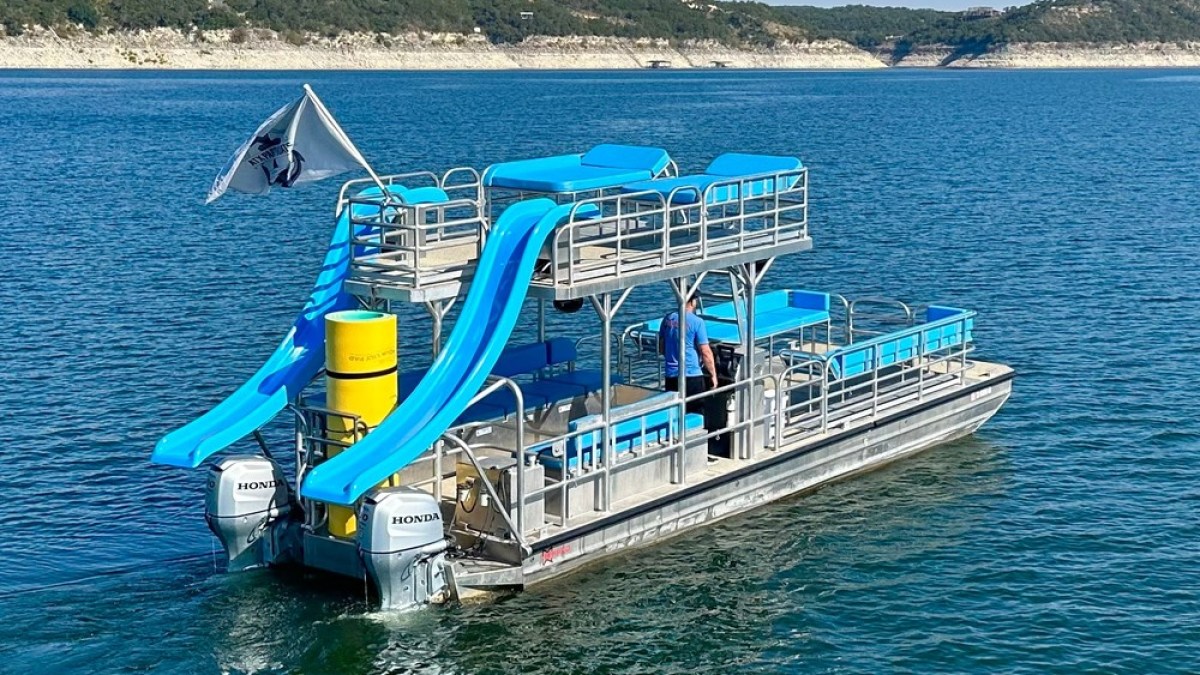 a blue boat on a body of water