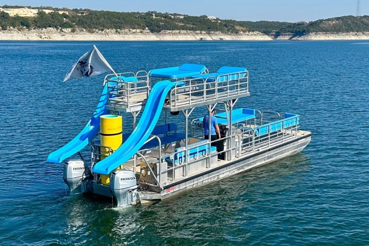 a blue boat on a body of water