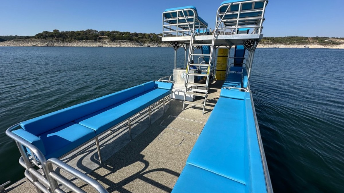 a boat is docked next to a body of water