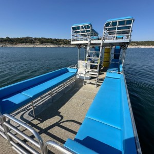 a boat is docked next to a body of water