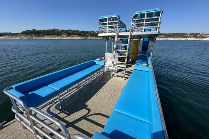 a boat is docked next to a body of water
