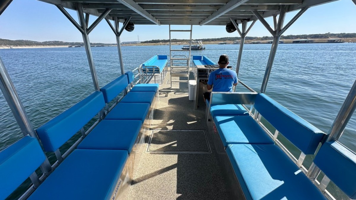 a boat is docked next to a body of water