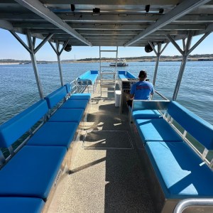 a boat is docked next to a body of water