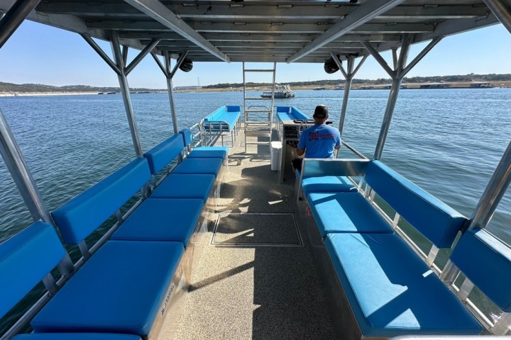 a boat is docked next to a body of water