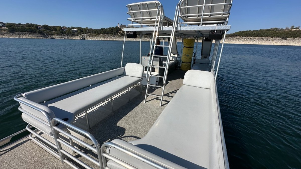 a boat is docked next to a body of water