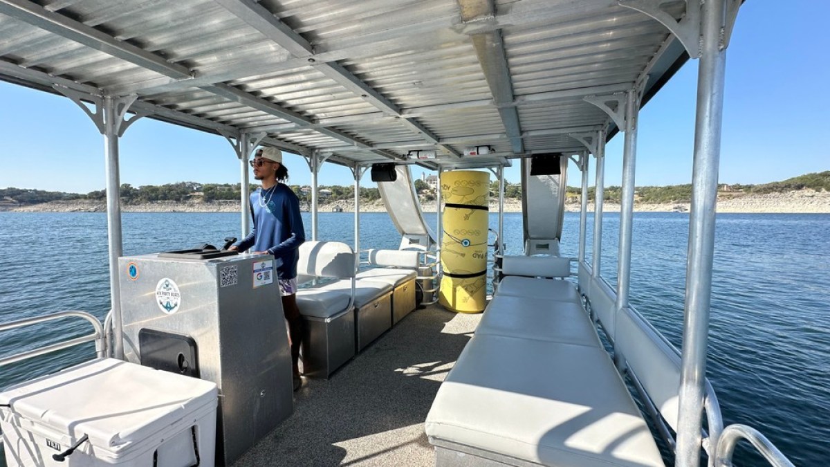 a group of people sitting at a dock