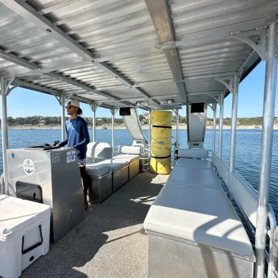 a group of people sitting at a dock