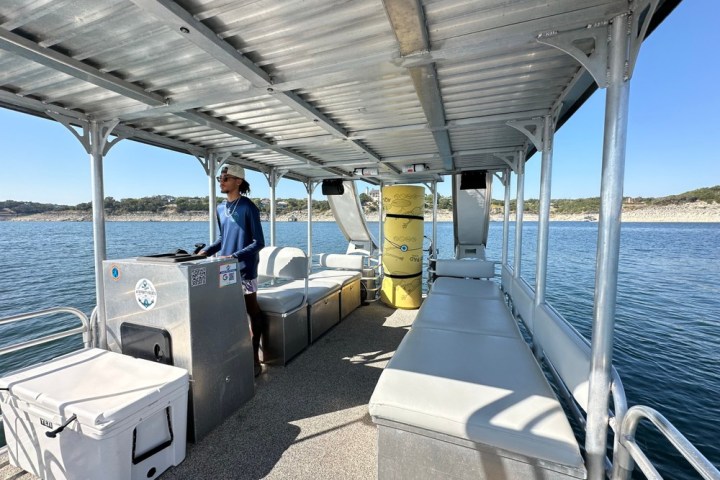 a group of people sitting at a dock