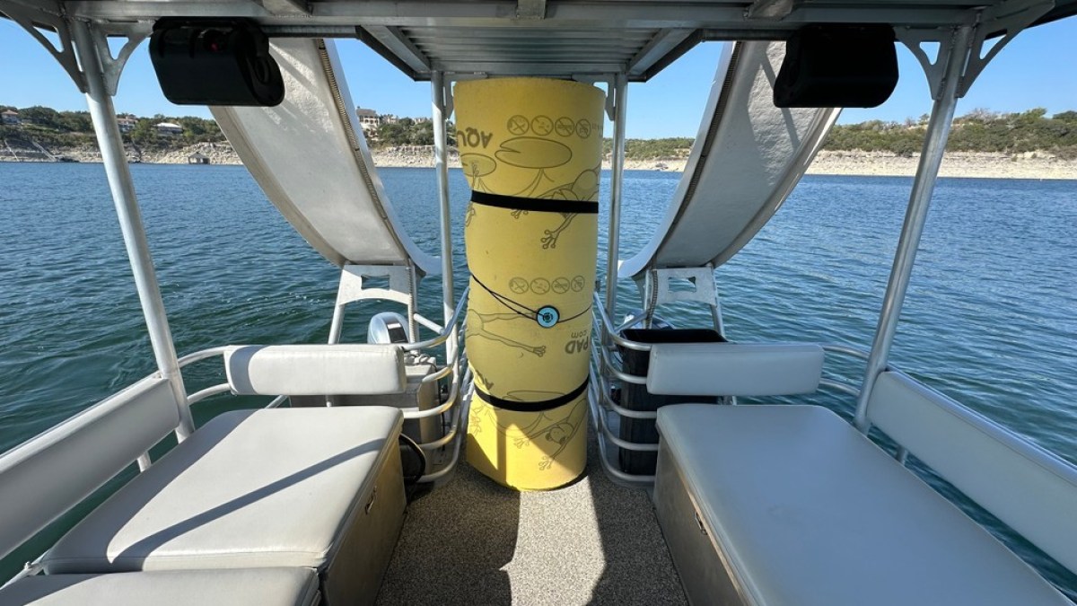 a boat sitting on top of a car