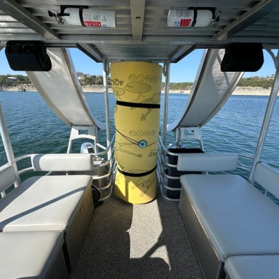a boat sitting on top of a car