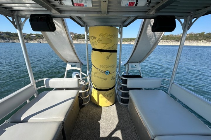 a boat sitting on top of a car