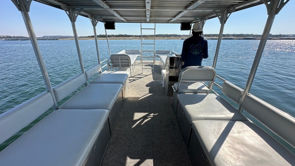 a boat that is sitting on a dock next to a body of water