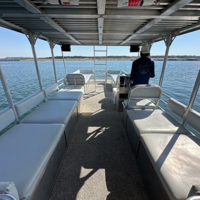 a boat that is sitting on a dock next to a body of water