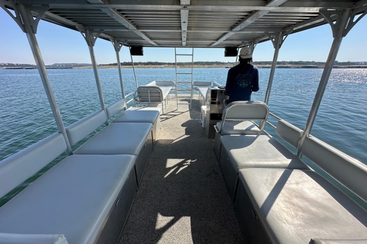 a boat that is sitting on a dock next to a body of water