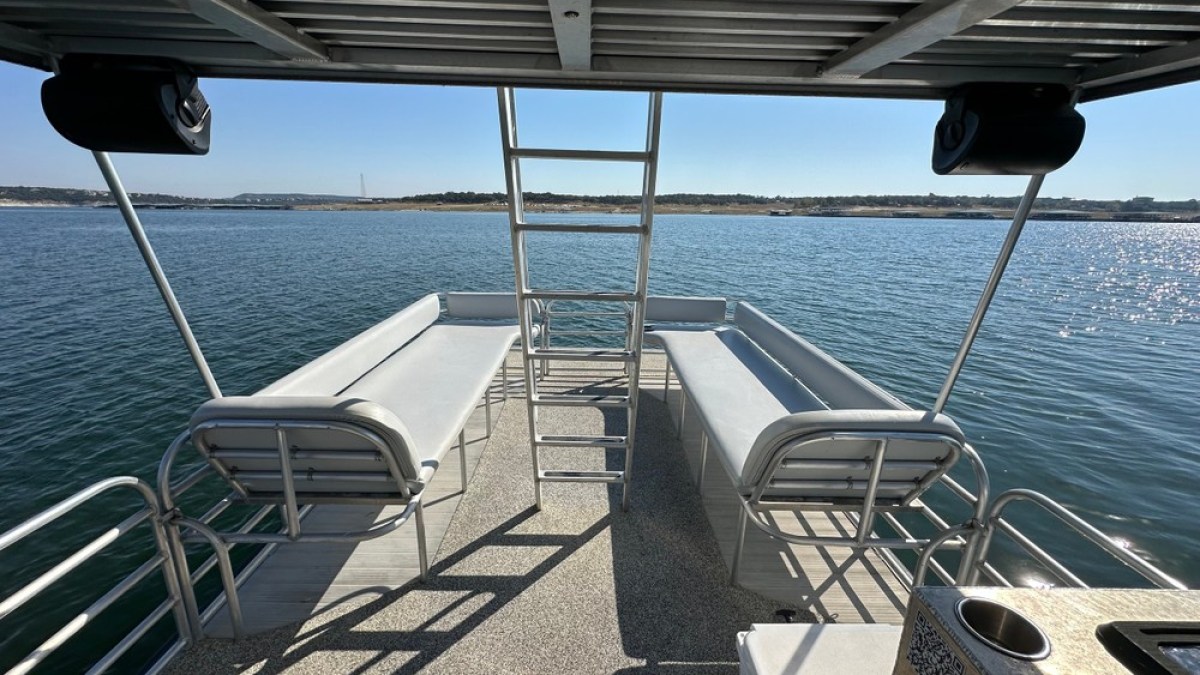 a chair sitting in front of a body of water