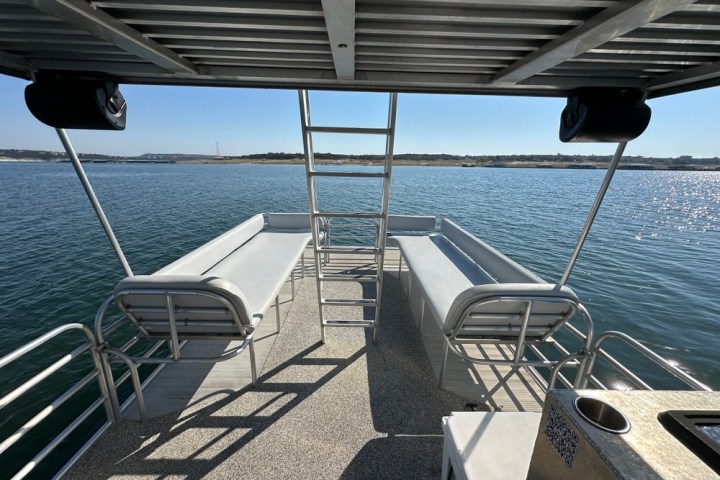 a chair sitting in front of a body of water