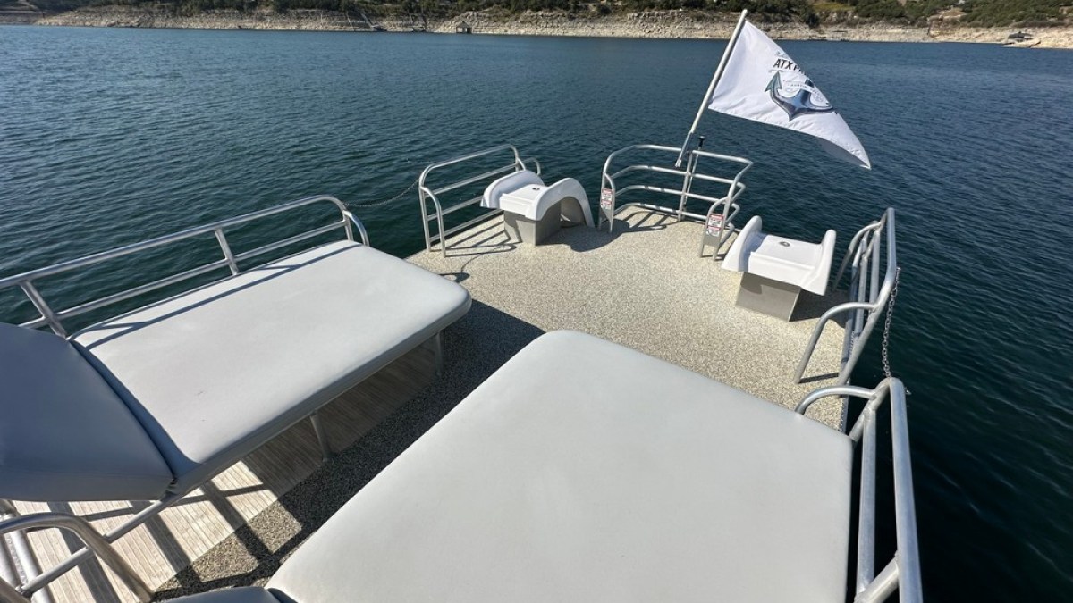 a chair sitting in front of a body of water