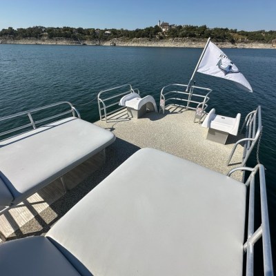 a chair sitting in front of a body of water