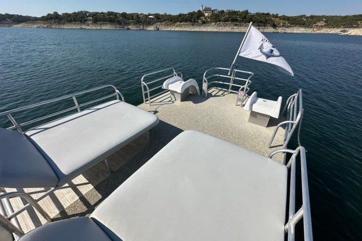 a chair sitting in front of a body of water