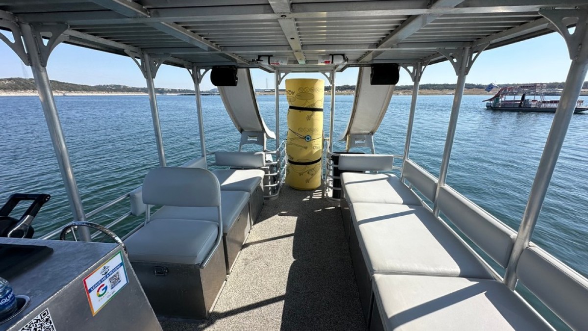 a boat is docked next to a body of water