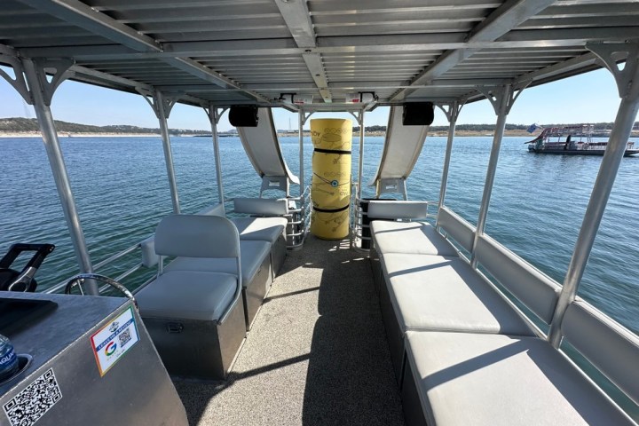 a boat is docked next to a body of water