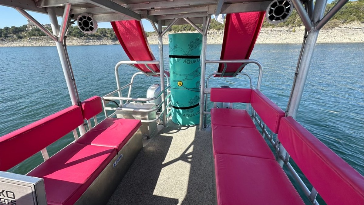 a boat is docked next to a body of water
