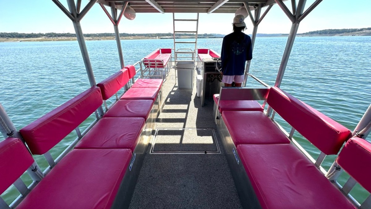 a boat that is sitting on a dock next to a body of water