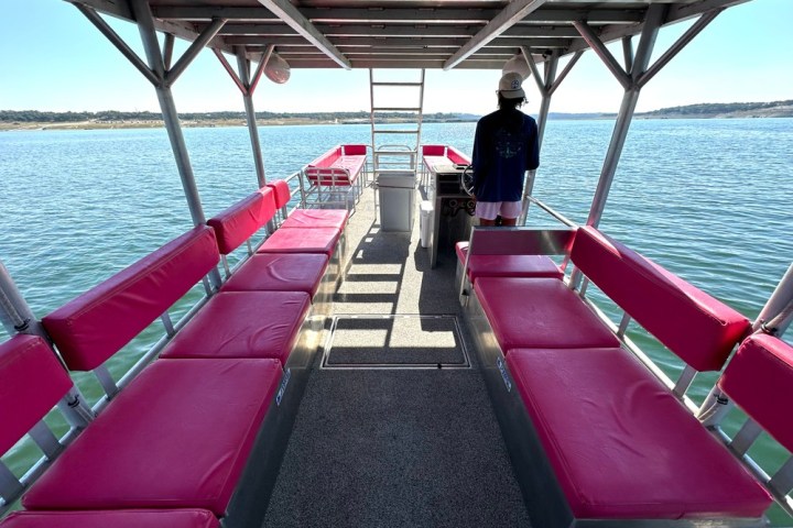 a boat that is sitting on a dock next to a body of water