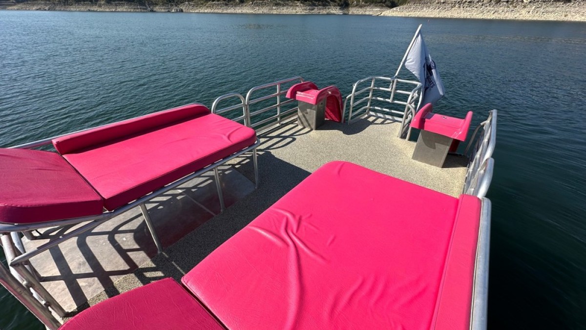 a chair sitting in front of a body of water