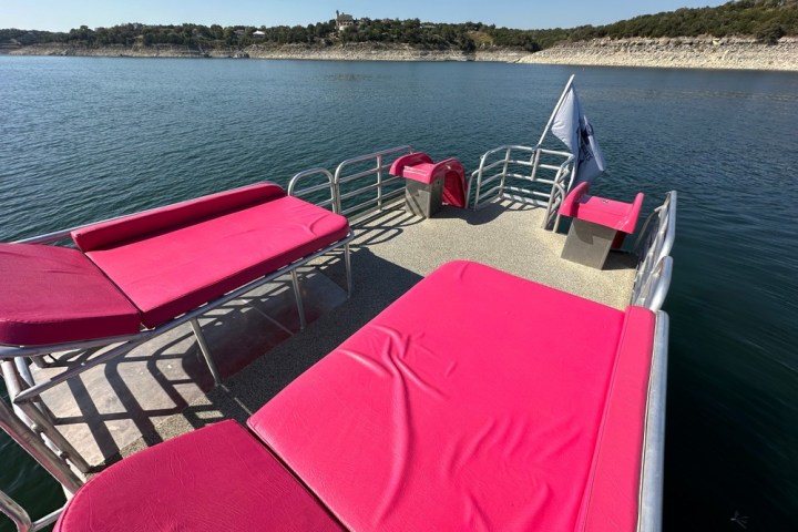 a chair sitting in front of a body of water