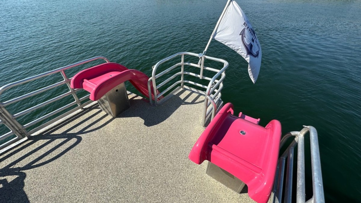 a chair sitting in front of a body of water
