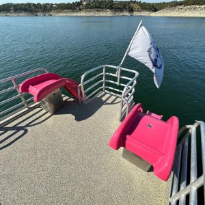 a chair sitting in front of a body of water