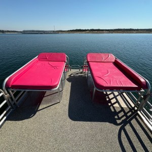 a chair sitting in front of a body of water