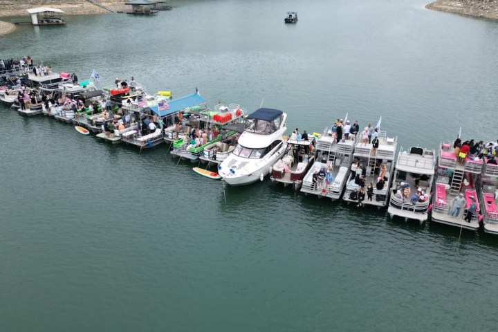 a boat is docked next to a body of water