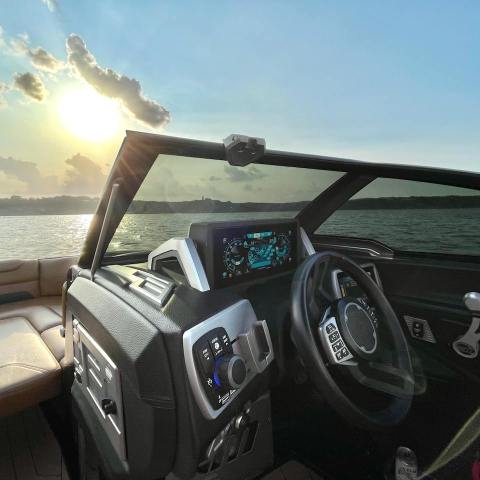 a boat sitting on top of a car