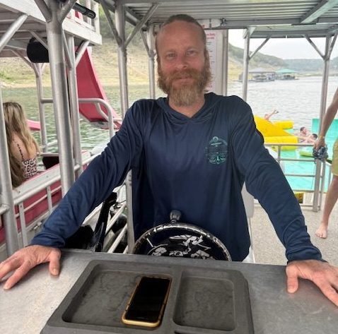 a man standing on a boat